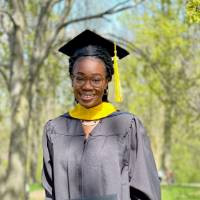 Smiling Professional Science Masters graduate